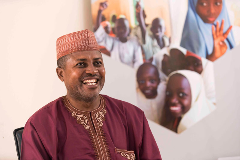 Nigerian man smiling.
